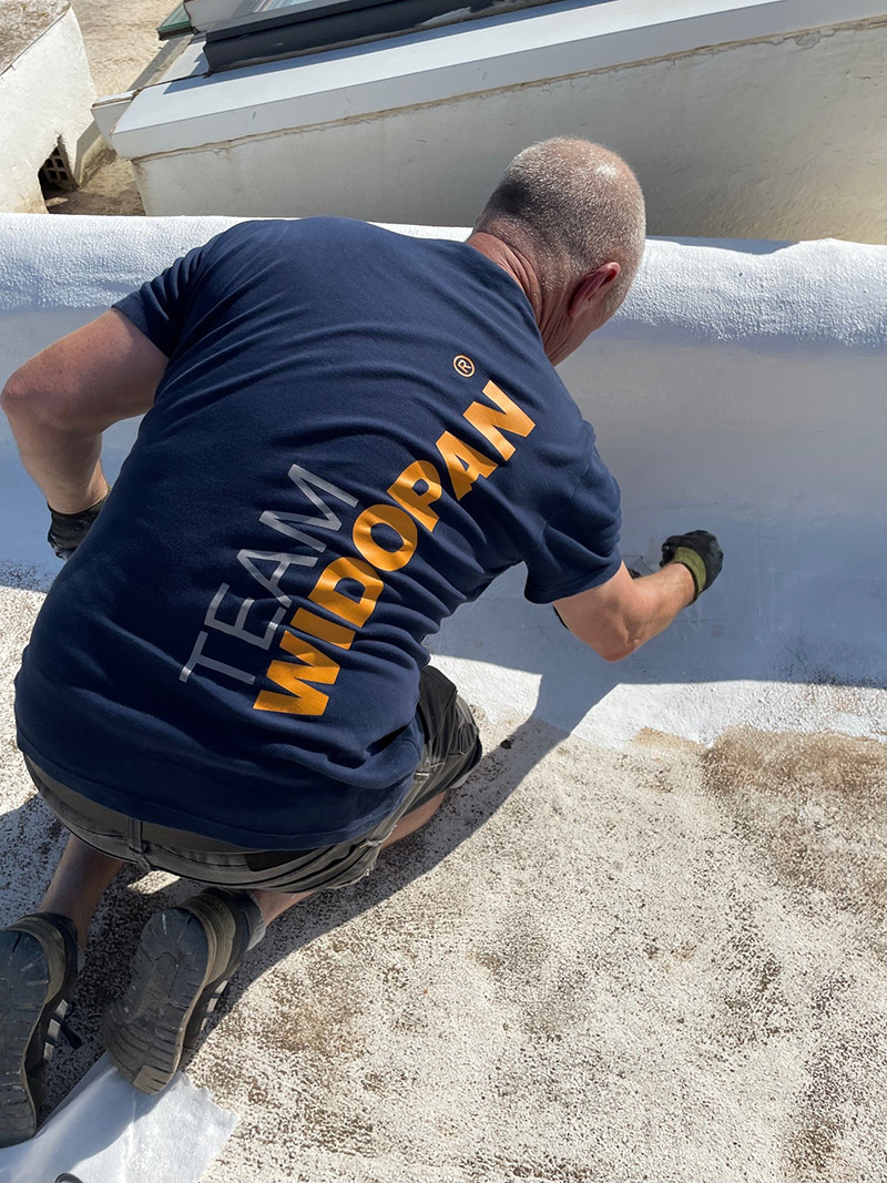 widopan expert roofer roofer on a roof applying widopan